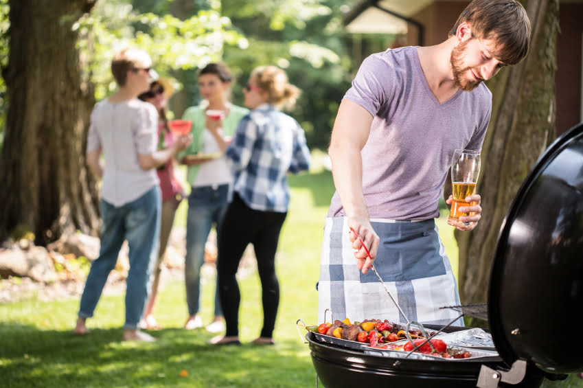 Young man grilling BBQ