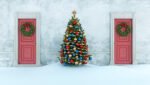 Christmas tree between two red doors