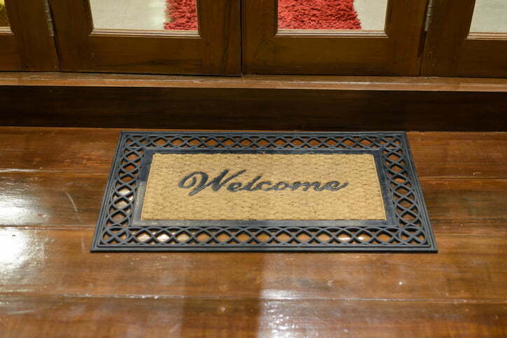 Welcome foot wipes on a porch