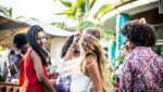 Friends dancing in a lounge bar, with dj set