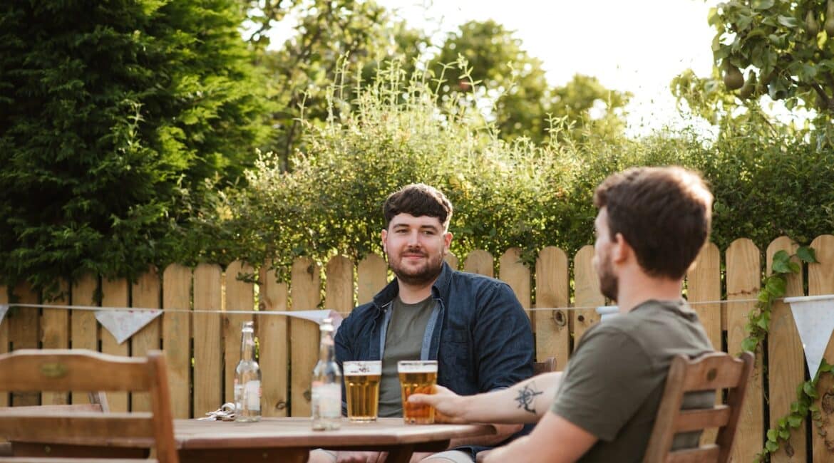 men drinking in patio