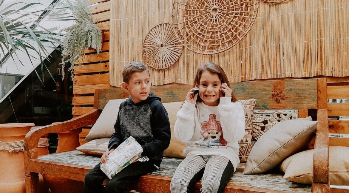 kids sitting on patio furniture