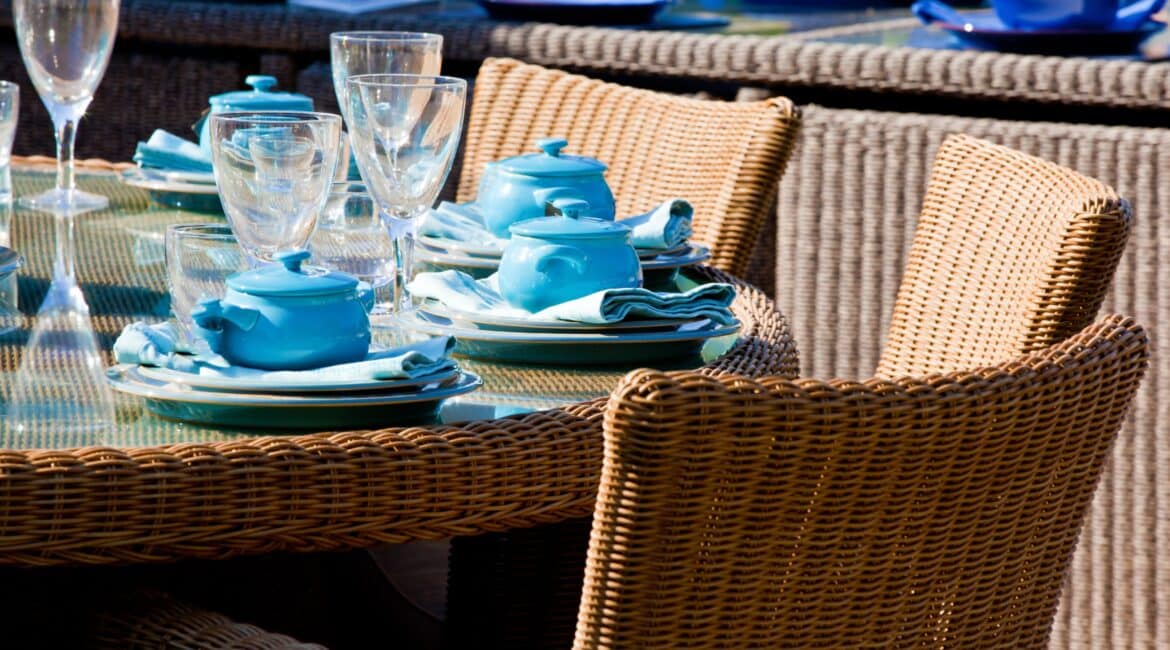 ,sunshine,bright,tea,dine,modern,furniture,chairs,waterproof,event,sunny,wine glasses,elegant,table,tea party,posh,weather resistant,wicker,glass,plates,set,teatime,dining,restaurant,picnic,dinner,seating,seat,blue,china,outdoors,outside,wooden,catering,refined,party;