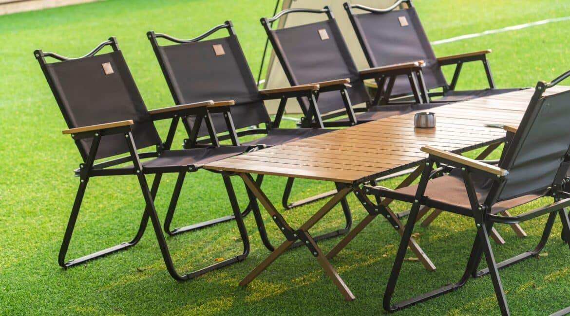 Stainless,Steel,Ashtray,On,Outdoor,Wooden,Table,In,Camping,Area