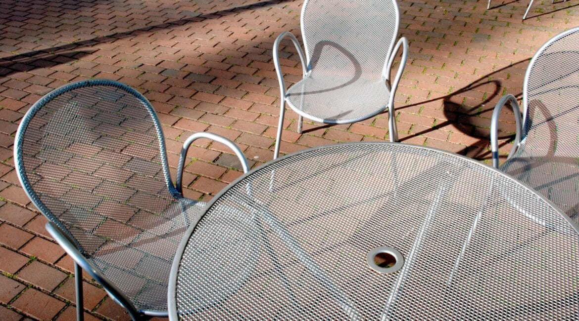 atmosphere,furnishing,lunch,yard,mood,snack,deck,drinks,banquet,feel,aluminum,vibes,silvery,setting,patio,tea,bar,fine,furniture,casual,leisure,open-air,park,table,veranda,chair,dining,relaxation,restaurant,metal,food,seating,morning,outdoor,seat,eatery,environment,cafe,courtyard,coffeehouse,light,saloon,meals;