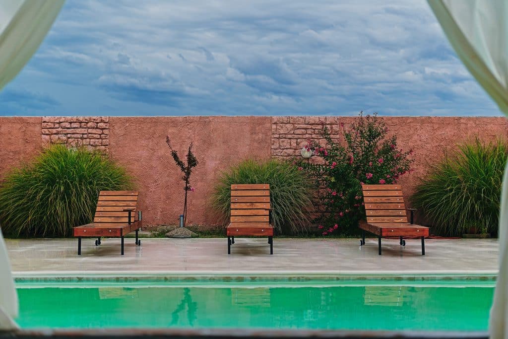 Poolside lounge chairs arranged for outdoor seating