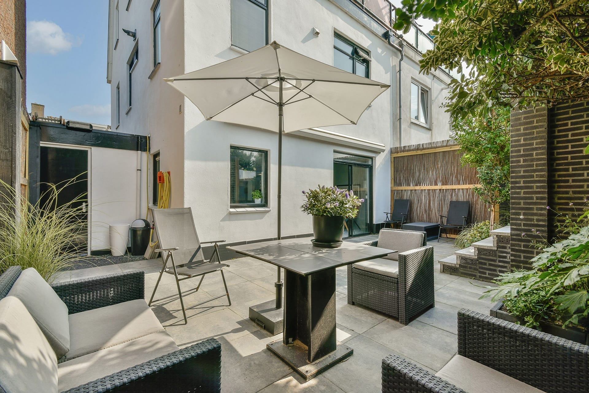 Florida patio design trend 2026 — modern dining table with pergola