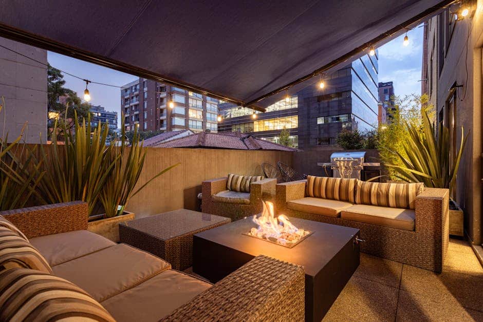 Florida screened lanai conversation pit with deep sectional seating and central fire table