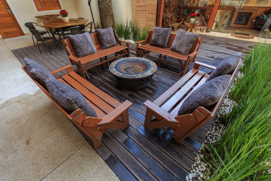 All-weather resin wicker and Sunbrella cushions on a fire pit conversation set in a Florida backyard